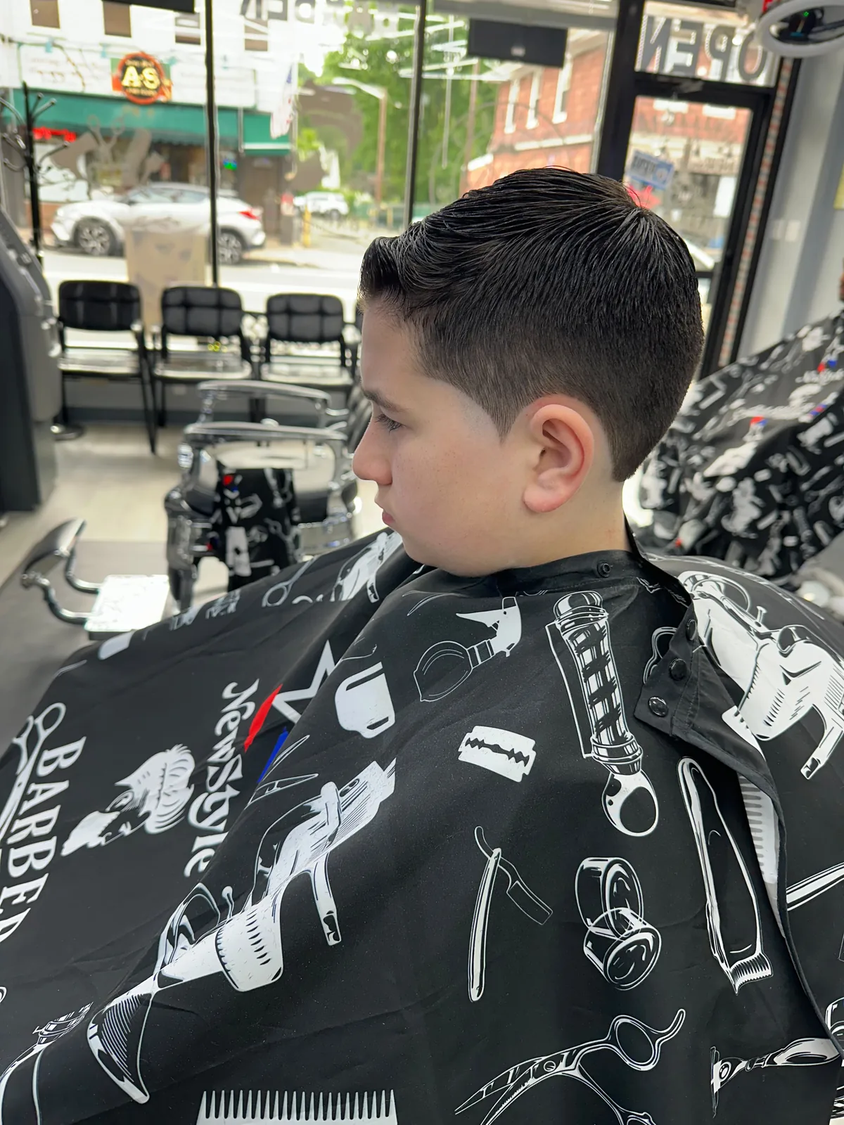 A young client with a fresh classic taper at New Style