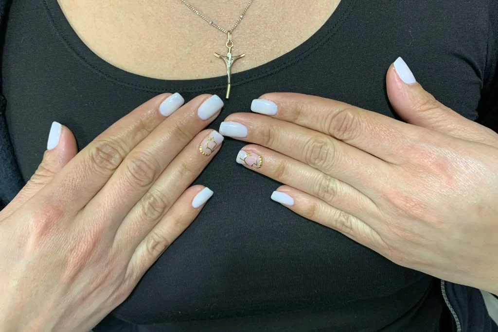 Client manicure with white French tips
