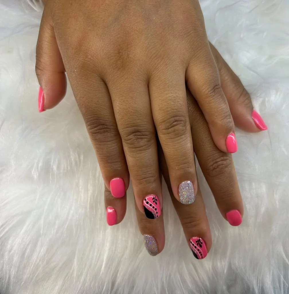 Pink manicure with floral accent nail art